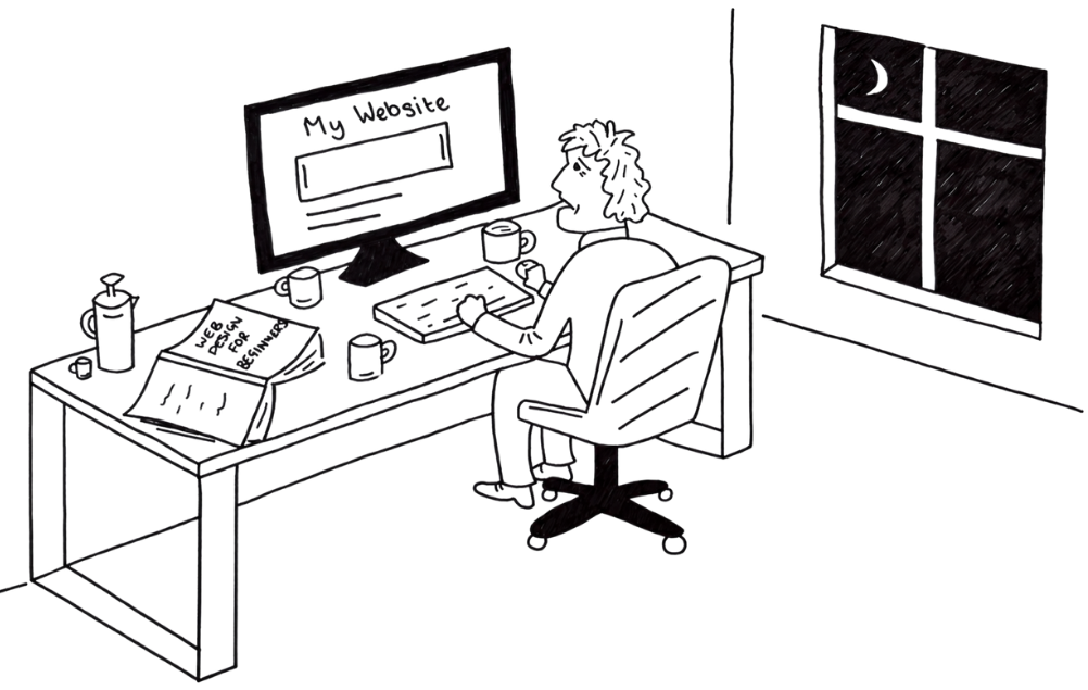 Man sitting at a desk making a website